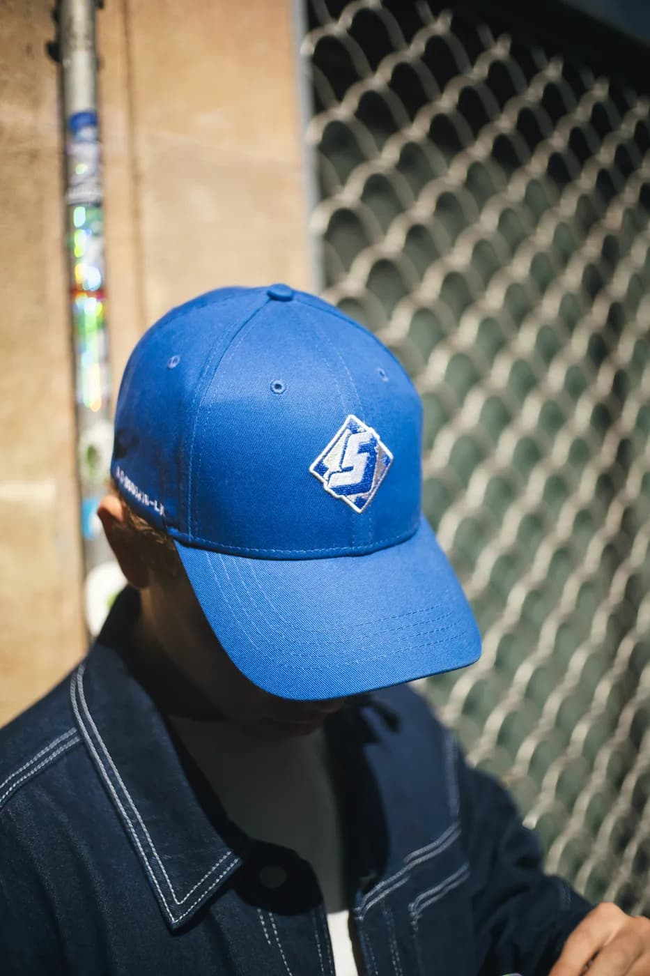 The Diamond Cap in royal blue, the S diamond embroidered on the front panel.